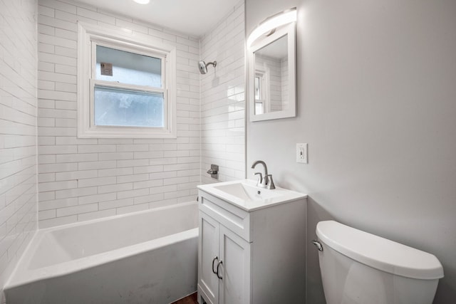 full bathroom featuring shower / washtub combination, vanity, and toilet