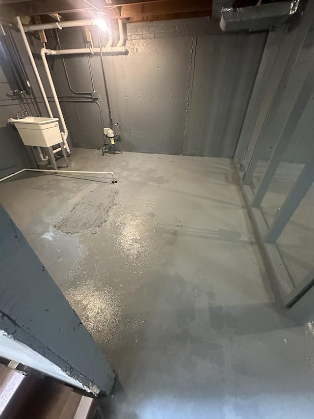 unfinished below grade area with a sink