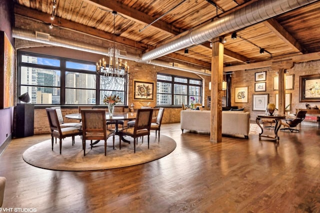 dining area featuring an inviting chandelier, wooden ceiling, wood finished floors, and beam ceiling