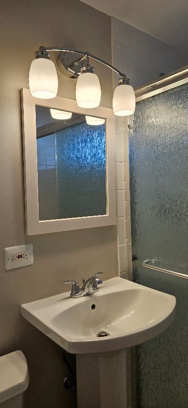 bathroom with a sink and toilet