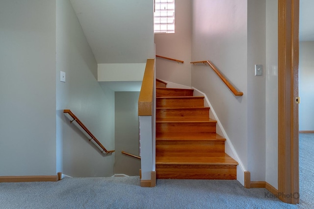 stairs with baseboards and carpet floors