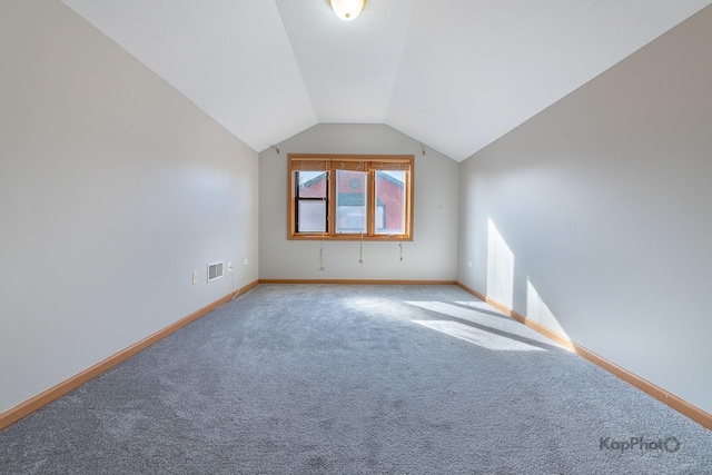 bonus room featuring visible vents, carpet flooring, lofted ceiling, and baseboards