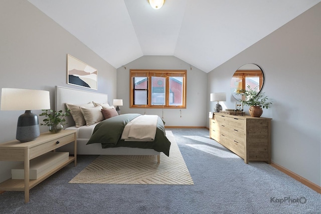 bedroom featuring baseboards, multiple windows, lofted ceiling, and light carpet