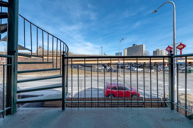 view of gate with a city view