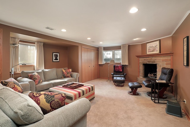 carpeted living room featuring recessed lighting, visible vents, ornamental molding, and a fireplace