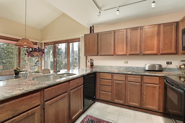 kitchen featuring a sink, black appliances, vaulted ceiling, and a healthy amount of sunlight