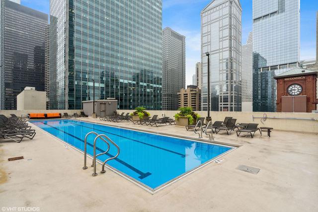 pool featuring a city view and a patio