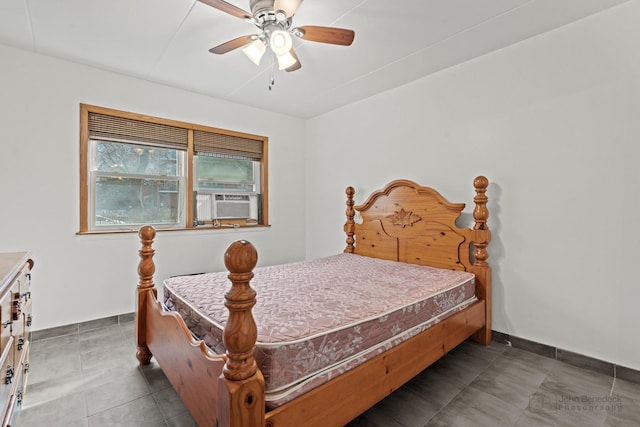 bedroom with ceiling fan, cooling unit, and baseboards