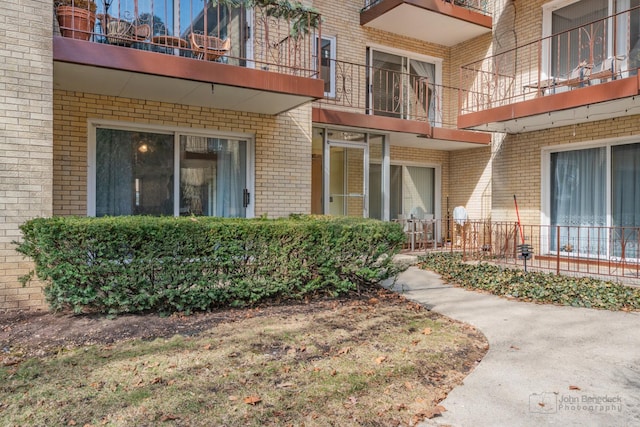 property entrance with brick siding