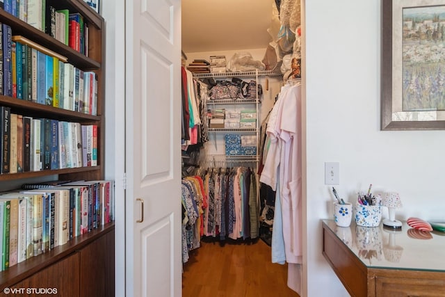 walk in closet featuring wood finished floors