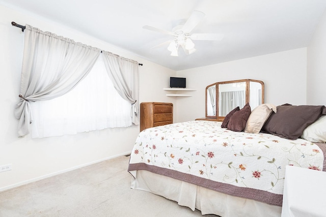 bedroom featuring baseboards, carpet, and a ceiling fan