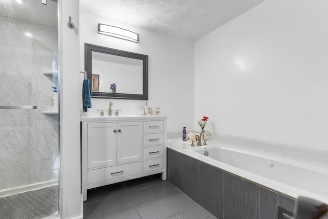 full bathroom featuring tile patterned flooring, a stall shower, vanity, and a garden tub