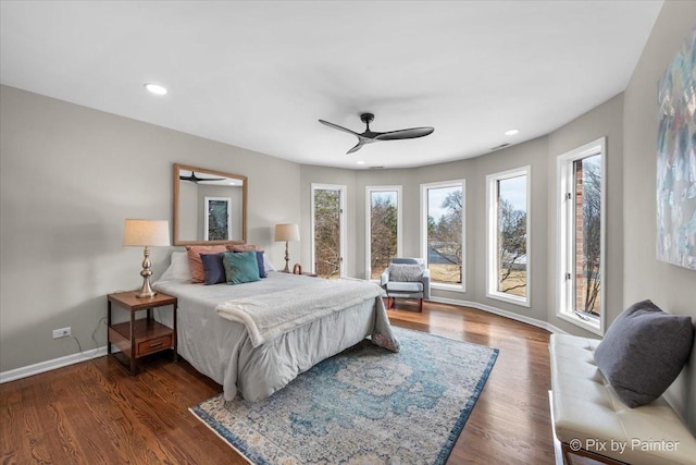 bedroom with baseboards, recessed lighting, dark wood-style flooring, ceiling fan, and access to exterior