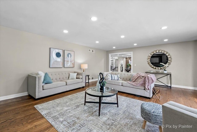 living room featuring recessed lighting, wood finished floors, visible vents, and baseboards