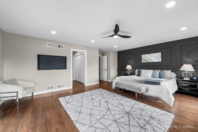 bedroom featuring recessed lighting, wood finished floors, and visible vents