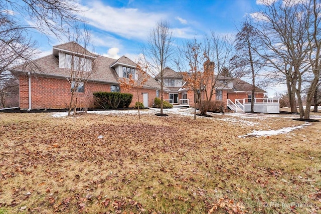 view of front of house with brick siding