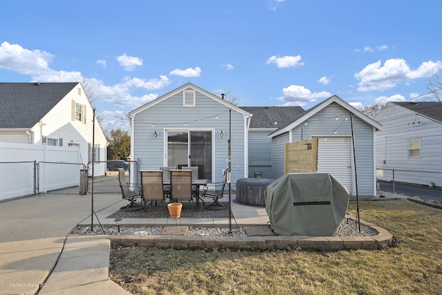 back of property featuring a gate, a patio area, and fence