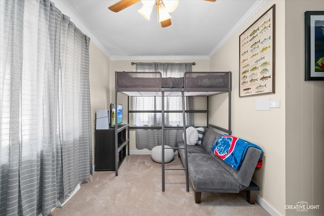 carpeted bedroom with baseboards and ornamental molding