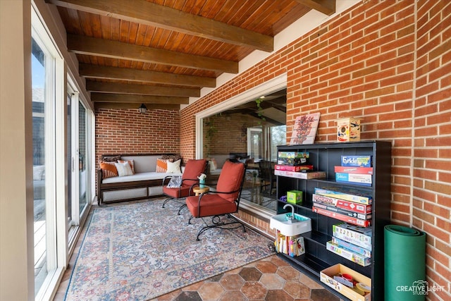 sunroom / solarium featuring beamed ceiling and wooden ceiling