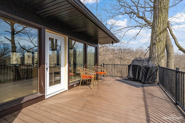 wooden terrace featuring area for grilling