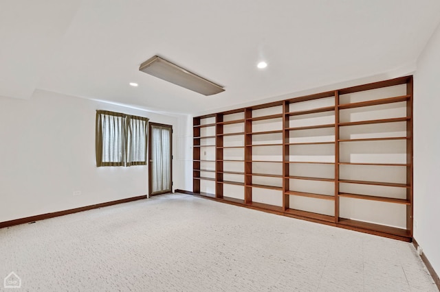 empty room with recessed lighting and baseboards