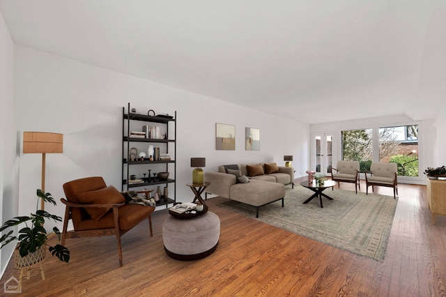 living area with hardwood / wood-style flooring