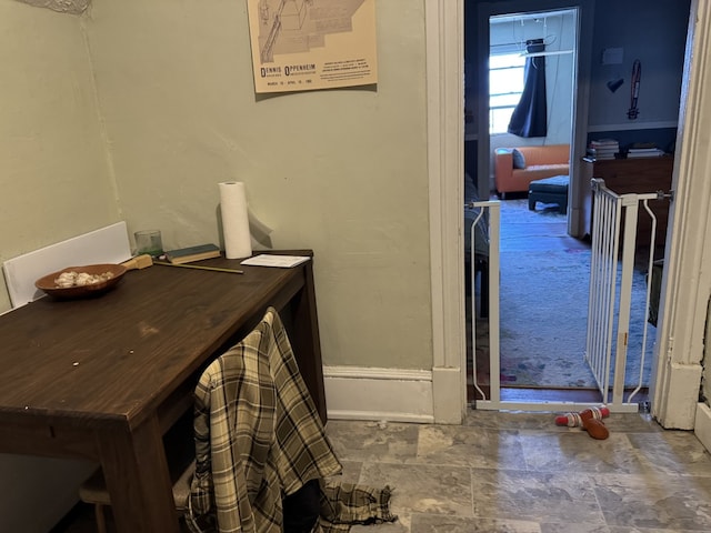 bathroom featuring stone finish flooring