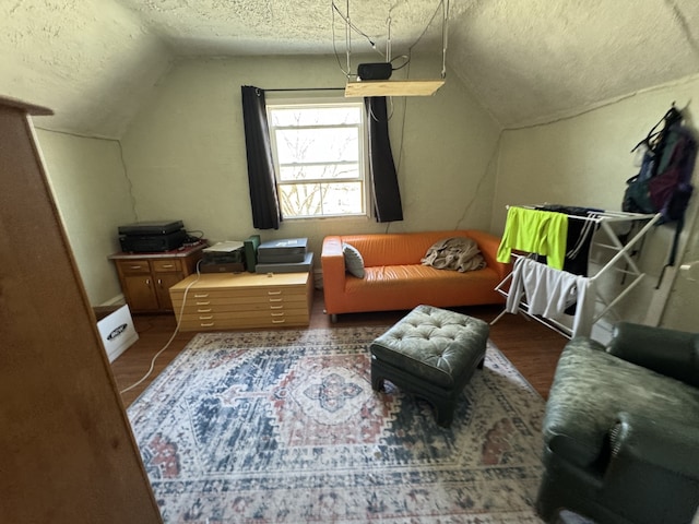 bonus room with lofted ceiling and a textured ceiling