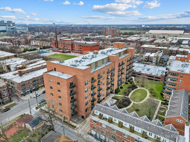 birds eye view of property with a view of city