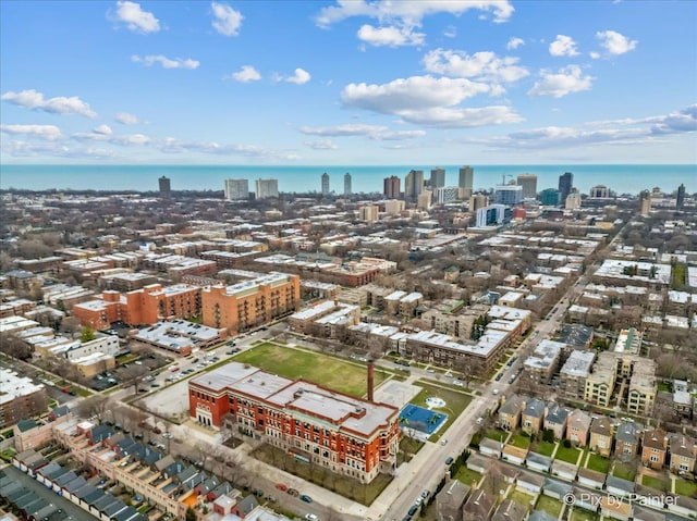 drone / aerial view featuring a view of city and a water view