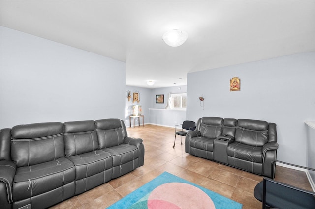 tiled living area with baseboards