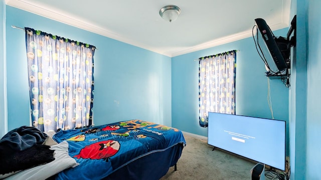 carpeted bedroom with crown molding