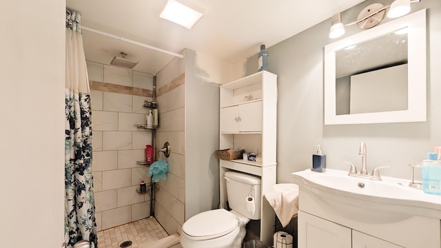 full bath with vanity, toilet, and a stall shower