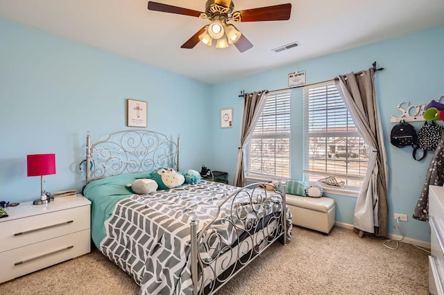 bedroom with visible vents, multiple windows, baseboards, and ceiling fan