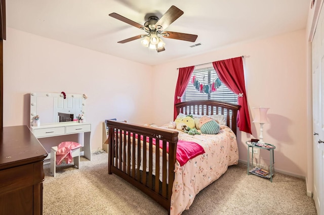 bedroom featuring carpet flooring, baseboards, and a ceiling fan