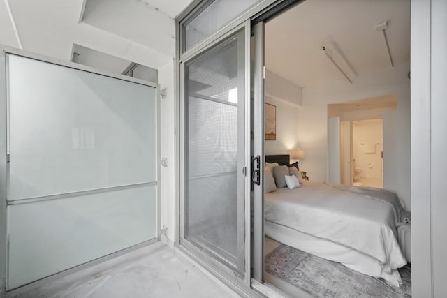 bedroom featuring unfinished concrete flooring