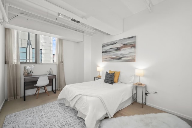 bedroom with baseboards and carpet flooring