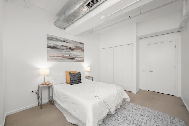 bedroom featuring visible vents, baseboards, and a closet