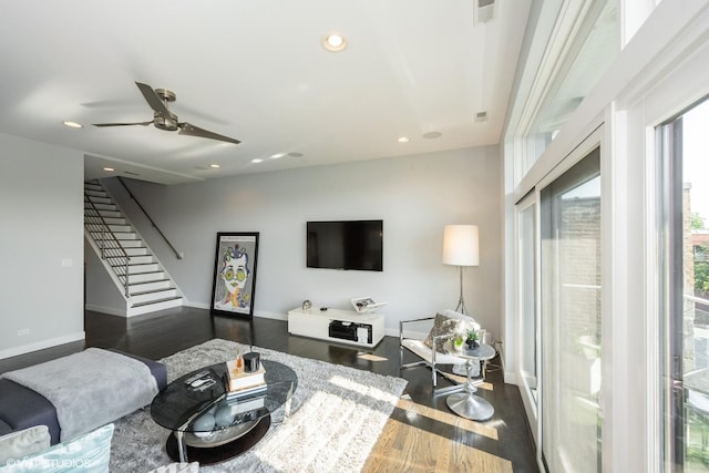 living room featuring baseboards, stairway, recessed lighting, wood finished floors, and a ceiling fan