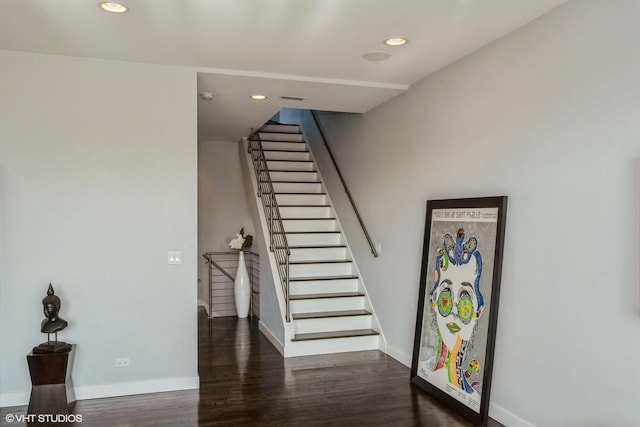 stairway with visible vents, recessed lighting, baseboards, and wood finished floors