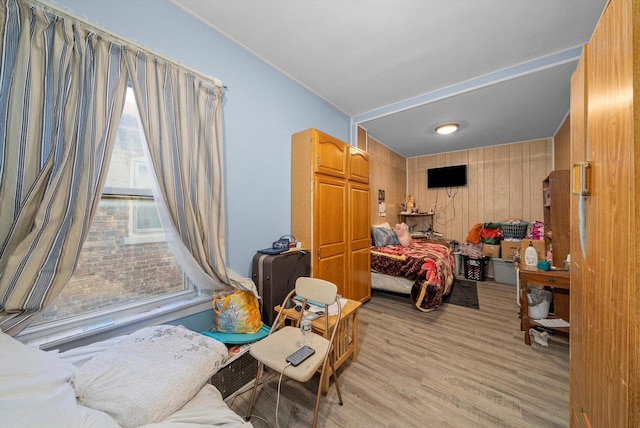 8325 S Dante Ave, Chicago, IL 60619 - bedroom featuring light wood-type flooring and wooden walls