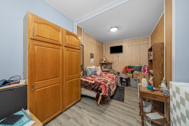 8325 S Dante Ave, Chicago, IL 60619 - bedroom featuring wood walls and light wood-style floors