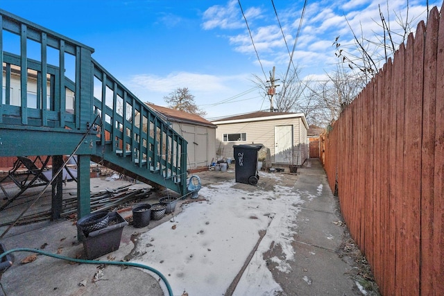 8325 S Dante Ave, Chicago, IL 60619 - view of yard featuring a storage shed, an outbuilding, stairway, and a fenced backyard