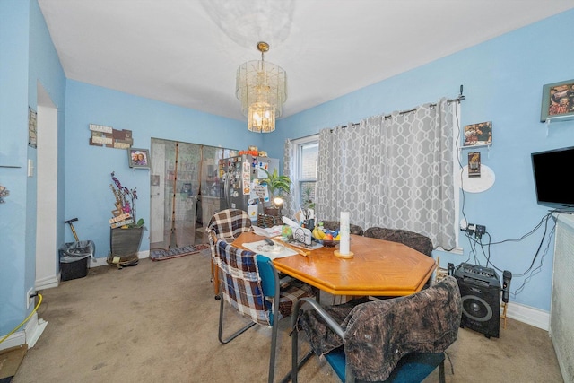 8325 S Dante Ave, Chicago, IL 60619 - carpeted dining area with baseboards and a chandelier