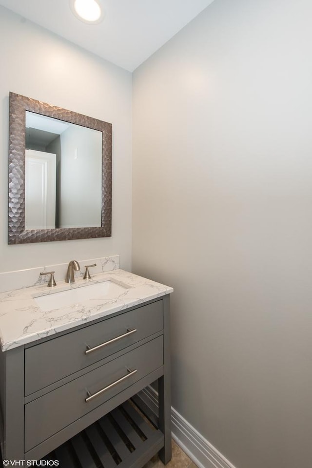 bathroom featuring vanity and baseboards