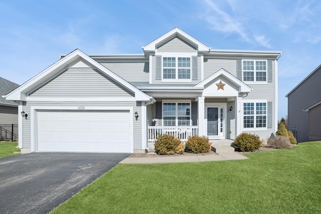 view of front of house with aphalt driveway, covered porch, an attached garage, and a front lawn