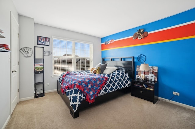 bedroom with baseboards and carpet floors