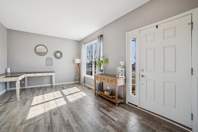 entrance foyer with baseboards and wood finished floors