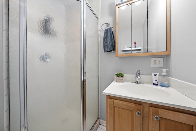 bathroom featuring vanity and a stall shower