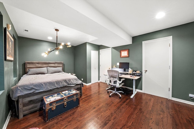 bedroom with a chandelier, baseboards, and wood finished floors